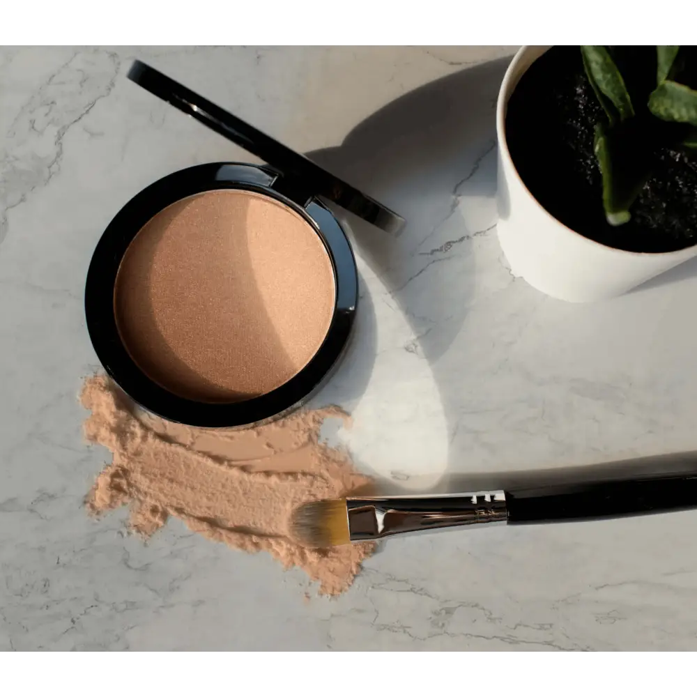 MIANIMED Premium skincare compact powder open showing peach-colored makeup inside black container.