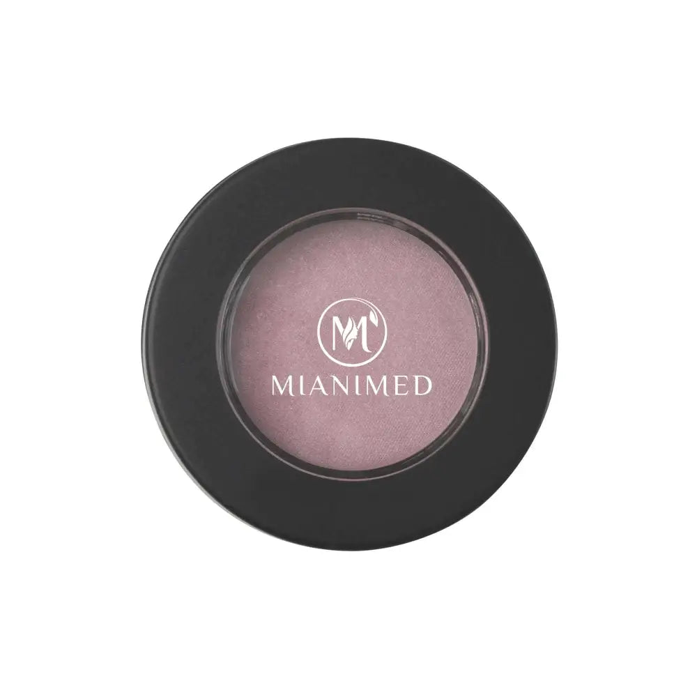 MIANIMED premium skincare product in black circular container with logo.